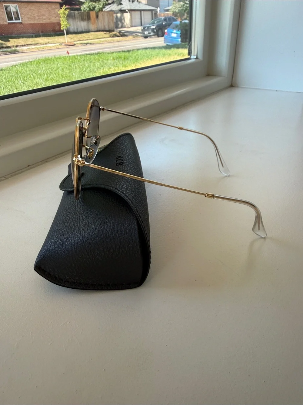 Ray-Ban Round Metal Frame Sunglasses with Green Lenses and Black Case